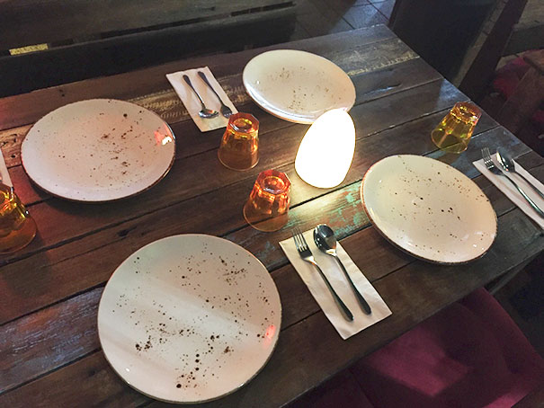 The Design Of These Plates At A Restaurant Makes It Look Like They Are Dirty