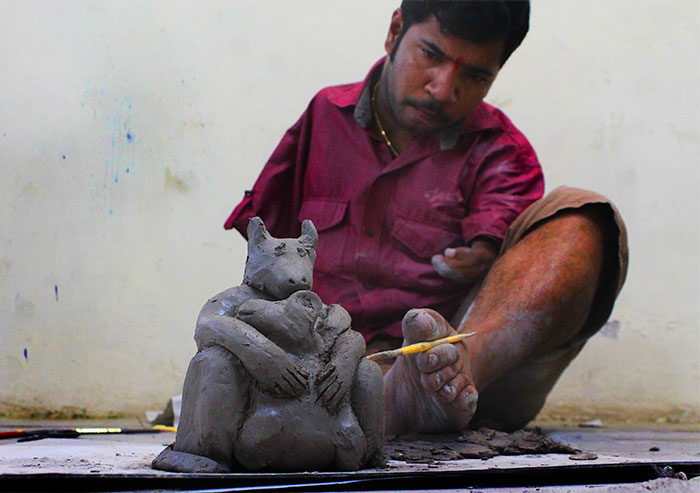 Disability Never Held This Mumbai University Student Back! Dhiraj Satavilkar, Who Has No Hands, Uses His Feet To Shape, Design And Paint Clay Models