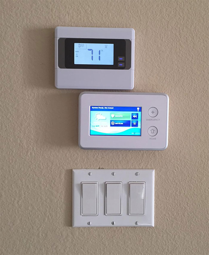 Alarm Company Installed A New Thermostat And Alarm Panel