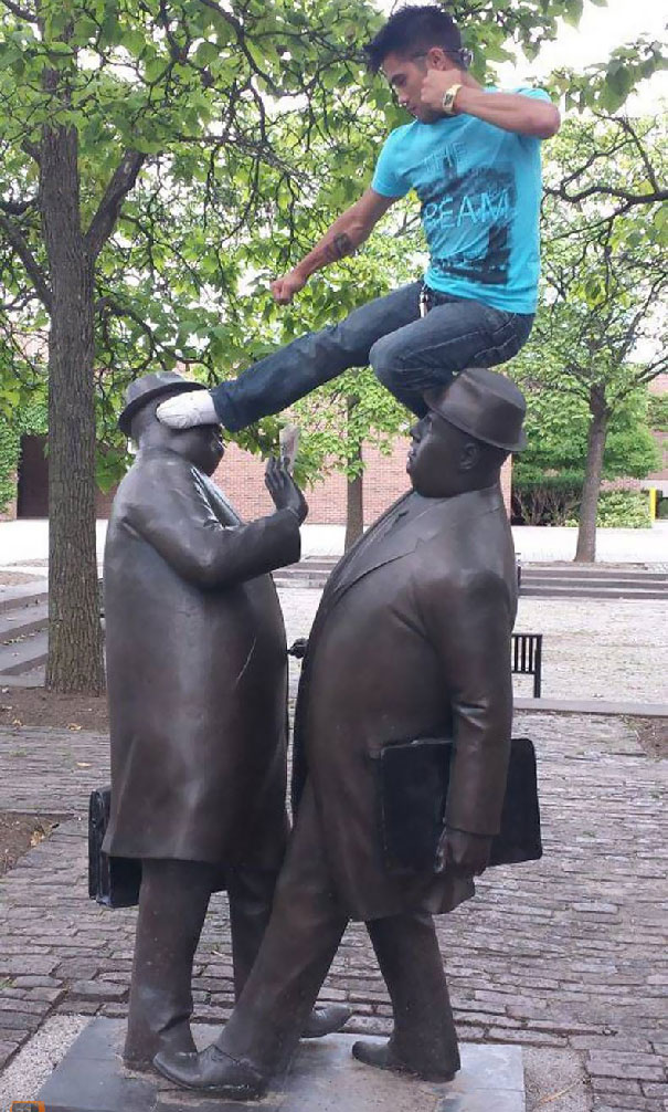 People Playing With Statues