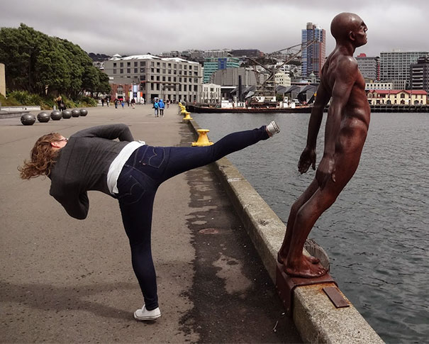 People Playing With Statues