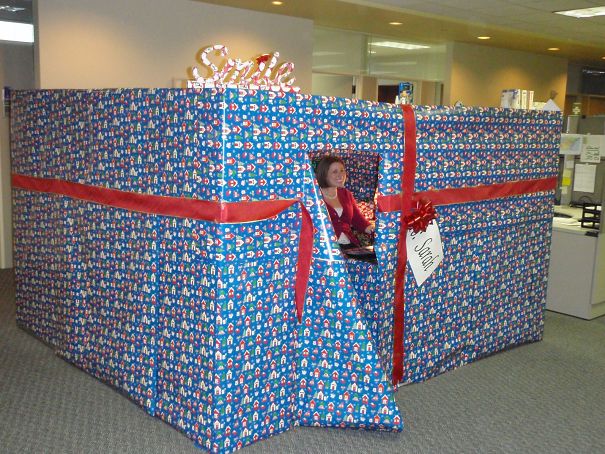 Sarah Peeking Out Of Her Wrapped Cubicle