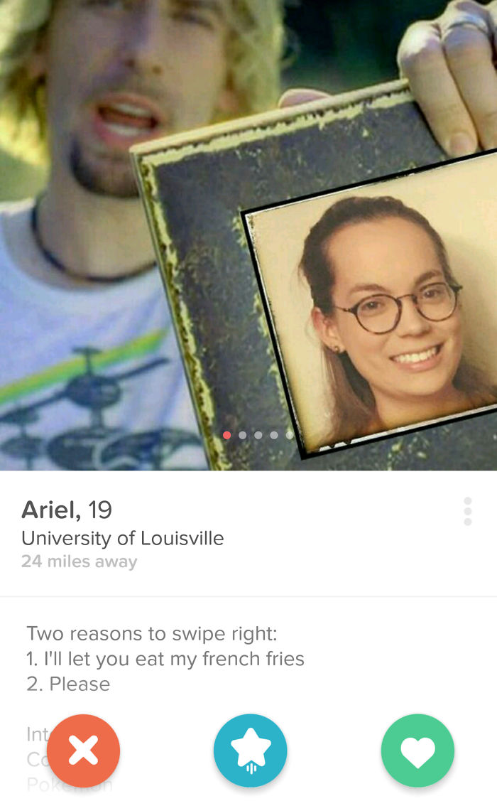 Tinder profile of womans’ photo in the frame that Nickelback holding 
