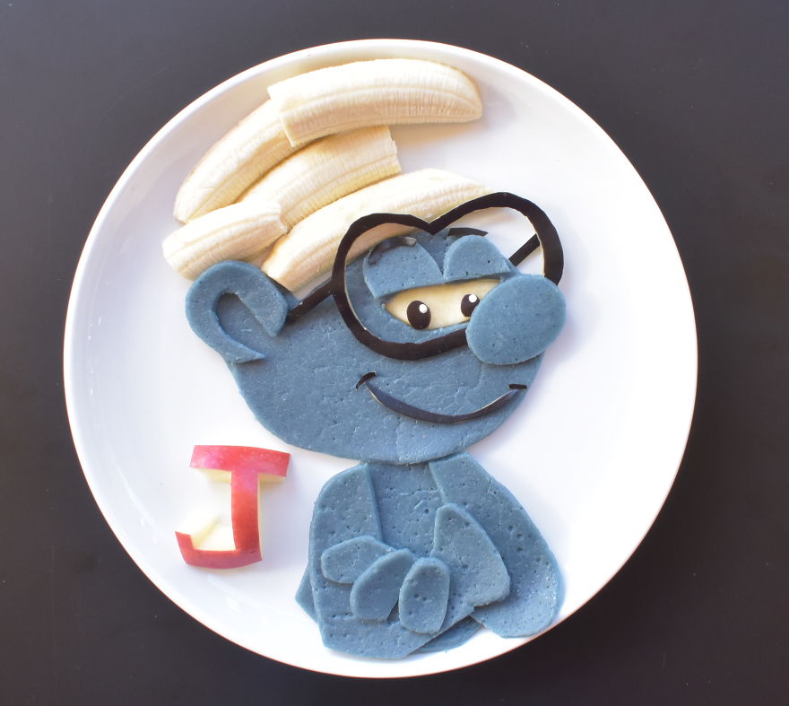 Brainy Smurf From The Smurfs Movie - Spelt Pancakes (dyed Using Blue Matcha) Served With Banana And Apple