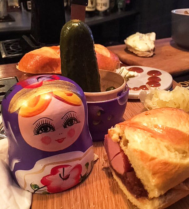 Pickles Inside A Russian Doll On A Chopping Board. Of Course