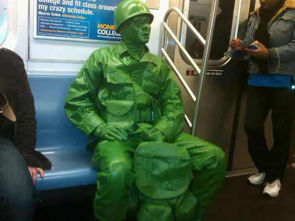 On The NYC Subway, Handing Out Little Green Army Men To Kids