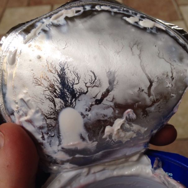 The Underside Of My Yogurt Lid Looks Like A Haunted Graveyard