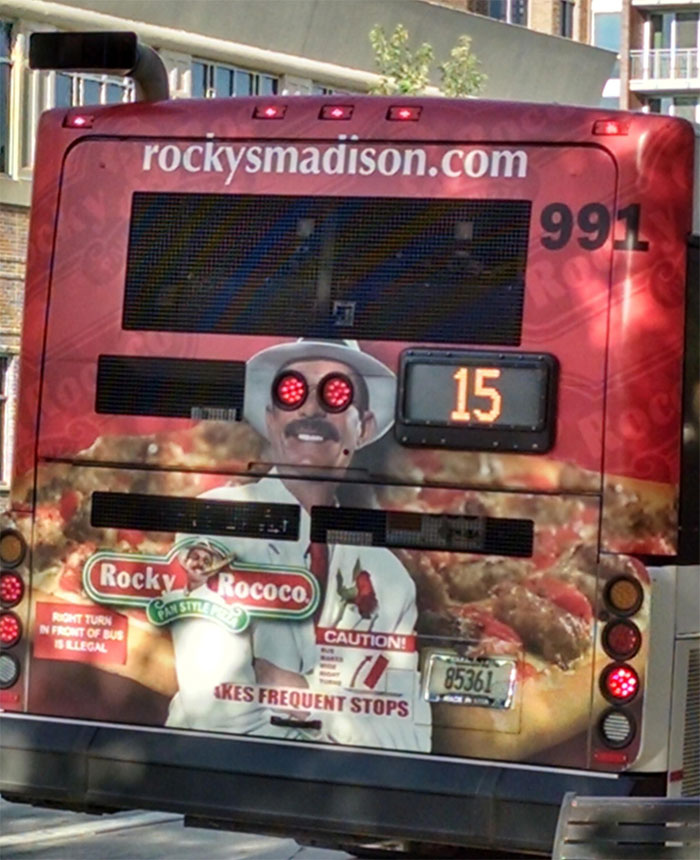 The Tail Light Placement On These Bus Ads Is Either Crappy Or Genius