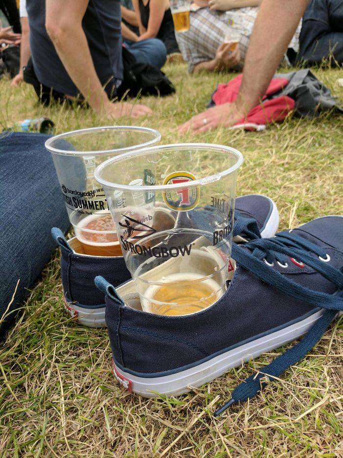 If Staying Put On Festival Grounds, Shoes Can Be Used For Handy Temporary Cup Holders On Uneven Surfaces