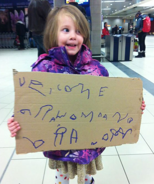 Kid Made A Sign For Grandma And Grandpa's Arrival. It's Getting A Lot Of Smiles At The Airport While We Wait
