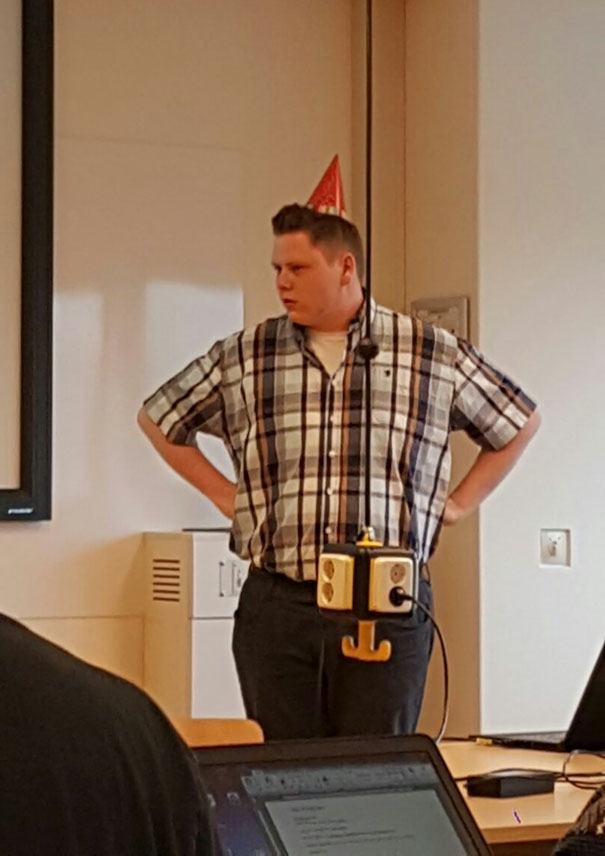 Person giving the final presentation with a party hat