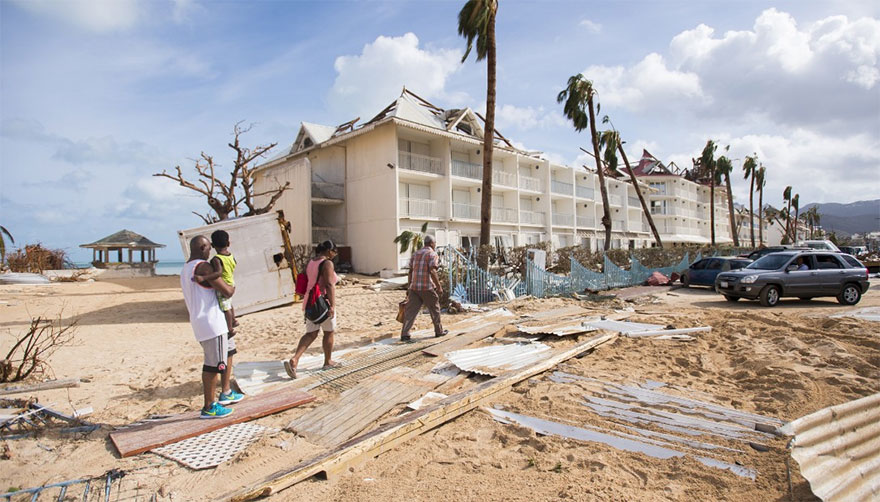 People Walk Through Damage In Marigot, St. Martin