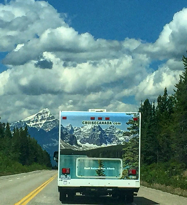 The Mountains And Trees Lined Up Perfectly On This Camper On The Highway