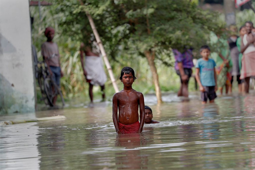 People Wait To Be Rescued From A Flooded Village In The Eastern State Of Bihar, India