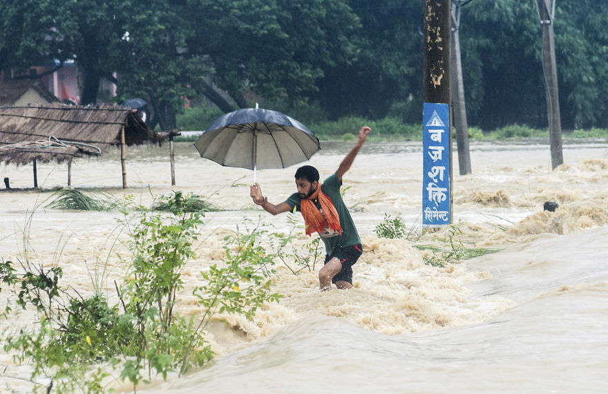 A Man Tries To Cross A Flooded Street In Birgunj, Nepal