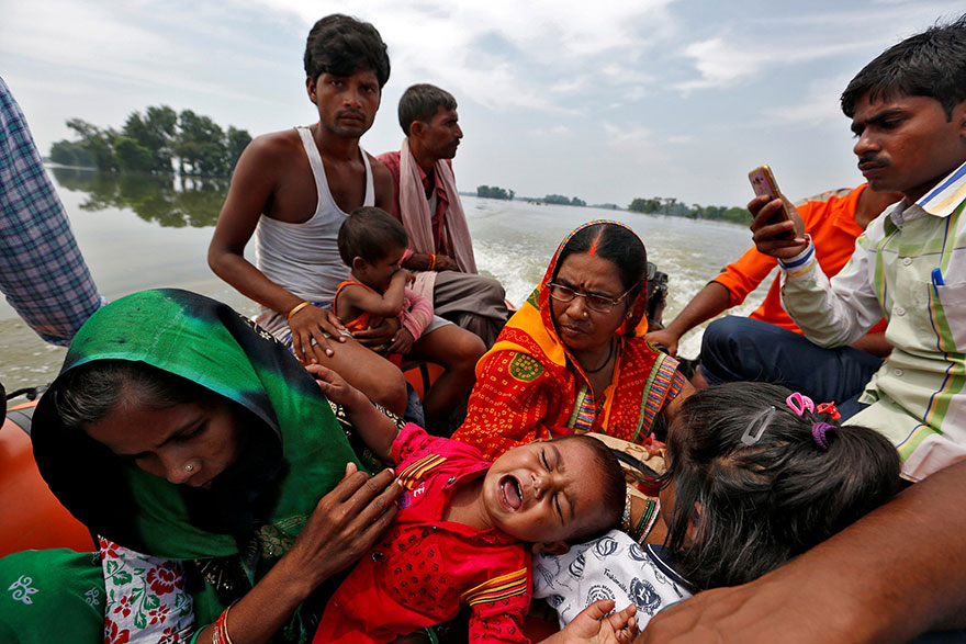 A Baby Suffering From Dehydration Cries After Being Rescued From A Flooded Village In The Eastern State Of Bihar, India