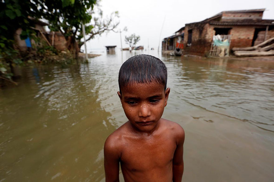 A Boy Is Pictured In A Flooded Village In Motihari, Bihar State, India