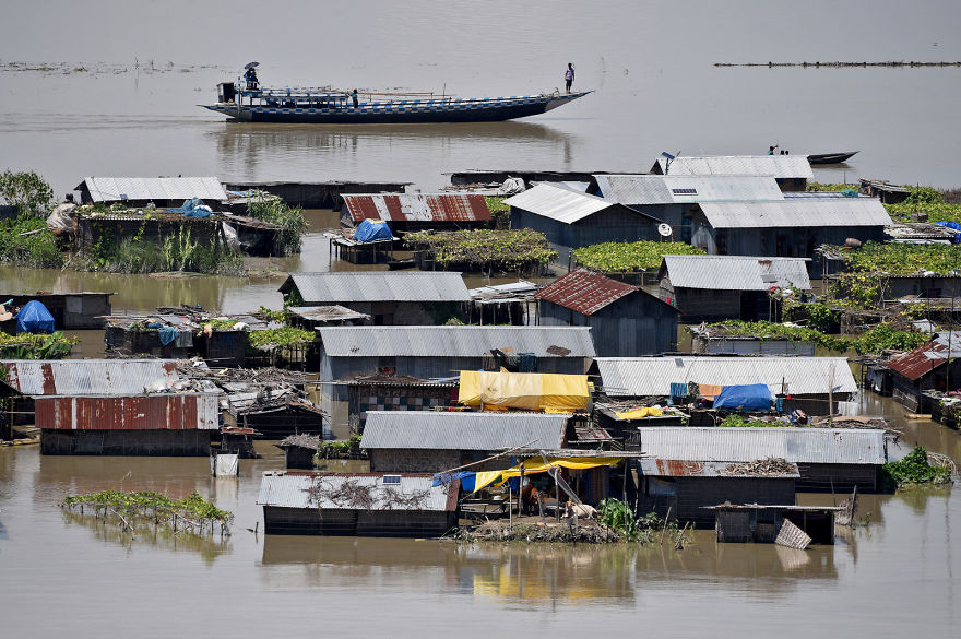 Houses Are Partially Submerged By Floods In Morigaon District In Assam