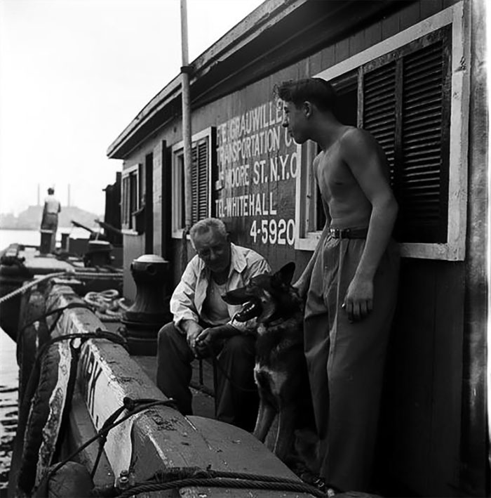 Men With German Shepherd On A Dock, 1949