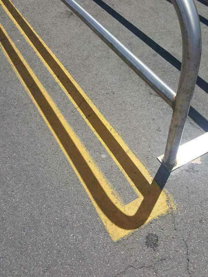 Shadow Fits On The Parking Lines Perfectly