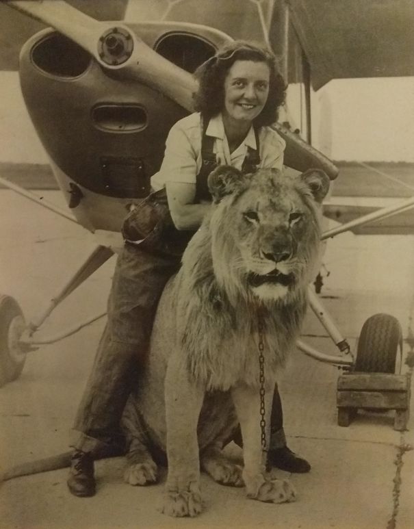 My Grandmother With Sultan, Her Favorite Lion From Her Troop, In Front Of Her Plane She Flew Just After WW2. 1947