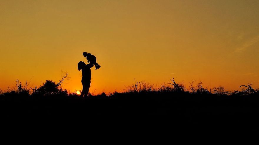 Mom-Daughter Silhouette In The Hungarian Sunset.