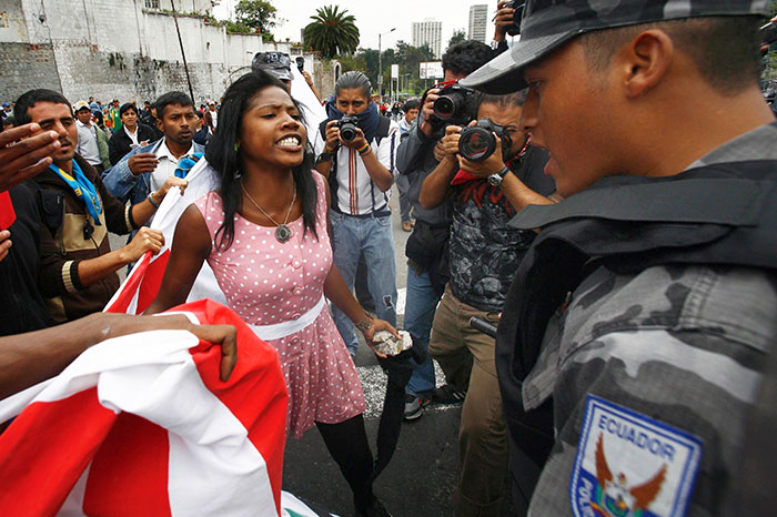 An Afro-Ecuadorean Woman Argues With Police Guarding A Fence In Front Of The National Assembly In Quito. In Protest Of A Proposed Water Privatization Law That Could Impact The Country’s Indigenous Population, 5 May 2010 