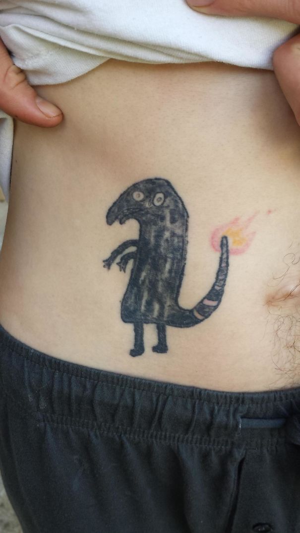 My Friend Was Drunk When He Decided To Tattoo A Black Face Charmander With No Experience Or Artistic Ability. The Flame Saves It