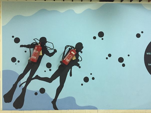 These Fire Extinguishers Disguised As Scuba Diving Tanks At An Airport