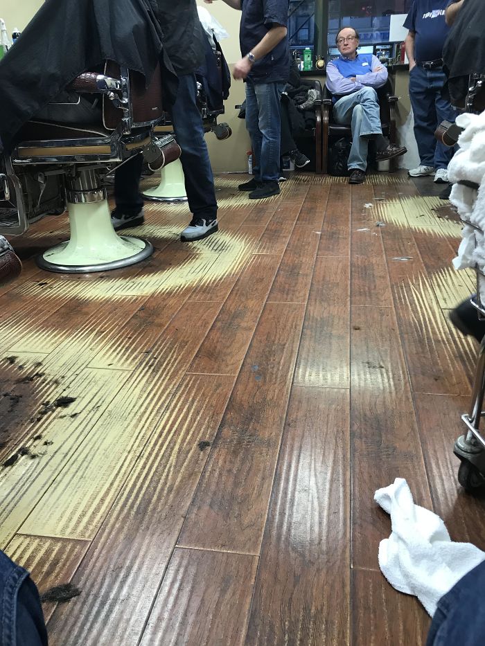 The Way The Floor Has Faded In Near Perfect Semi-Circles At This Barber Shop