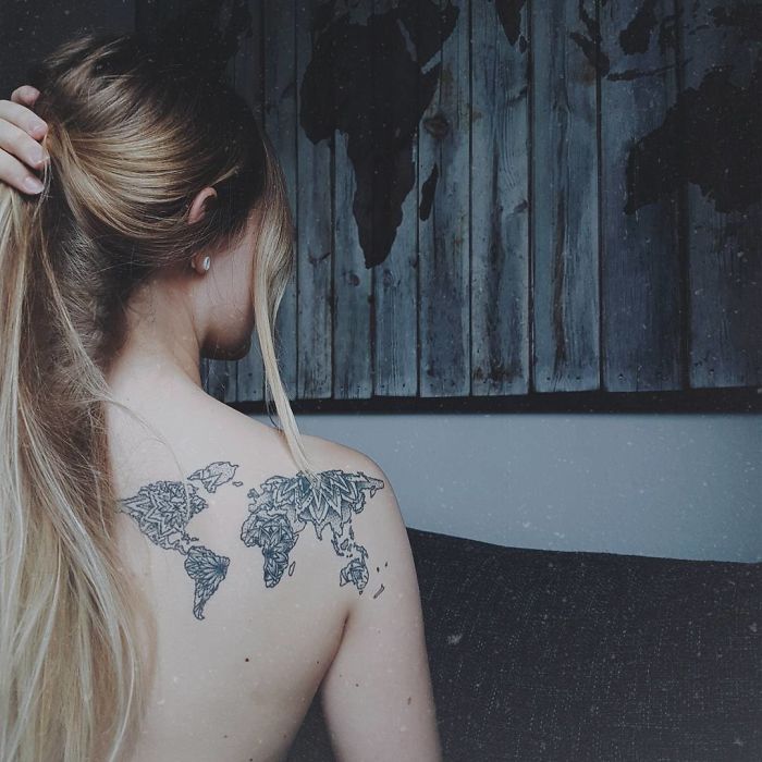 Mandala flower earth continents back tattoo