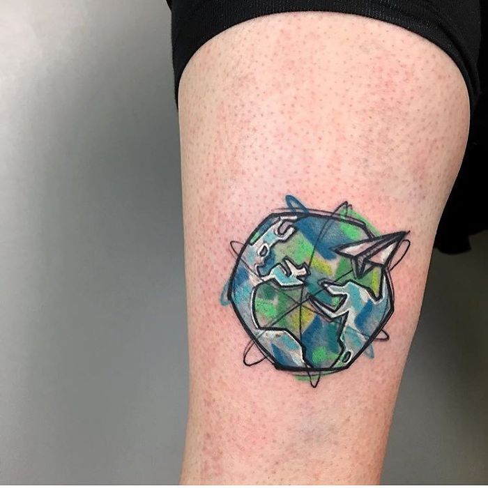 Colorful earth leg tattoo