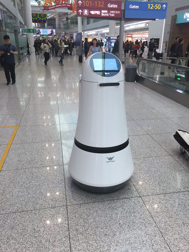 Robots Directing The Crowds At The Airport In Seoul