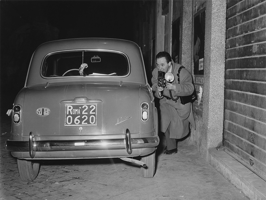 Photojournalist Tazio Secchiaroli Hides Armed With His Camera. Rome, 1958