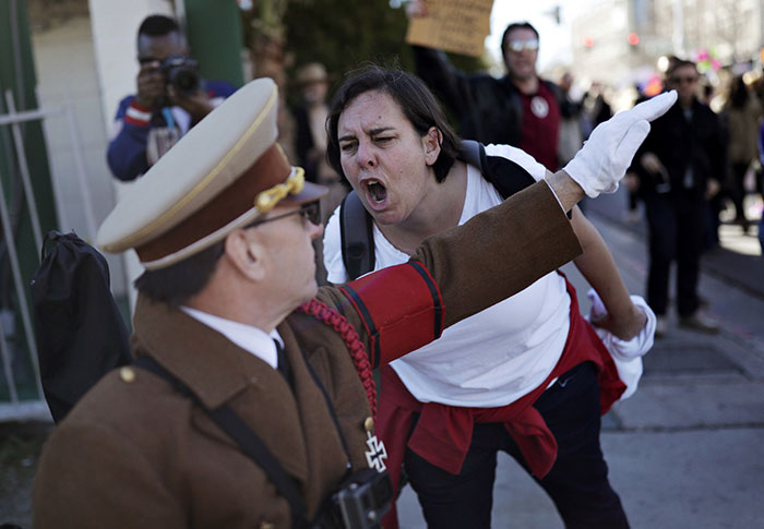 A Woman Yells At A Man Dressed As Adolf Hitler During A Protest Of Newly Inaugurated President Donald Trump At A Women's March Saturday, Las Vegas, 21 January 2017