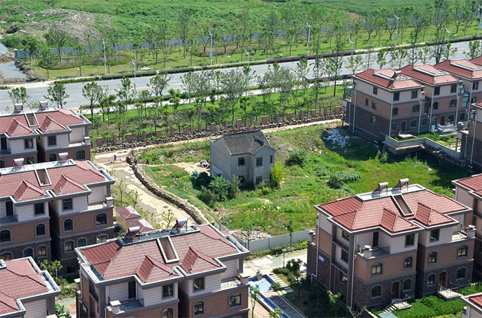 A Lone Resident Holds Out Against Luxury Villas In Suzhou, Jiangsu Province, In July 2013