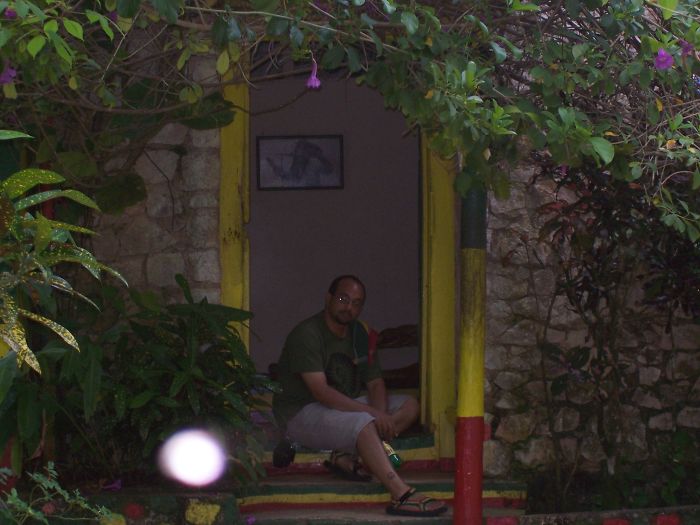 Sitting In The Doorway Of Bob Marley's House At Nine Mile Next To His Mausoleum. The Camera Never Took A Picture With A Spot Before This Shot, And Has Not Taken One Since... The Feeling I Had At The Same Time The Was Indescribable.