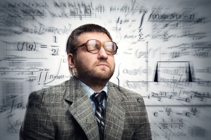 Professor in glasses eyes closed thinking about math formulas