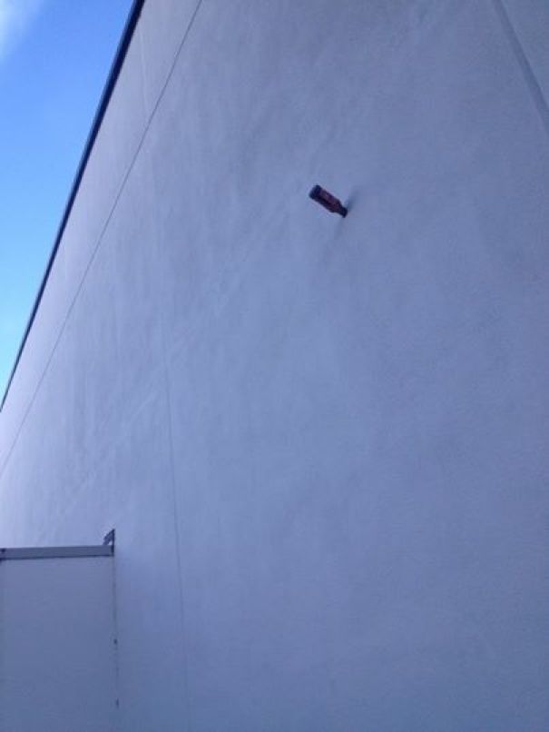 Someone Somehow Managed To Throw A Budweiser Bottle Inside The Wall Of My University Campus Without Smashing It