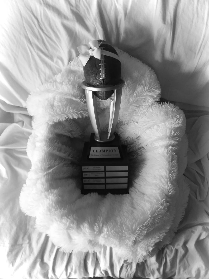 Woman Poses For Mommy-Baby Portraits With Fantasy Football Trophy Woman Poses For Mommy-Baby Portraits With Fantasy Football Trophy