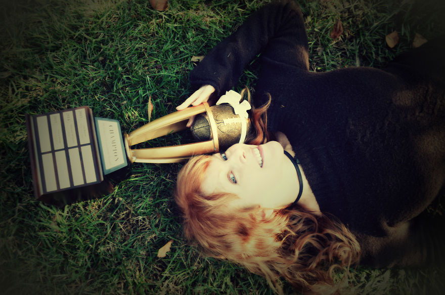 Woman Poses For Mommy-Baby Portraits With Fantasy Football Trophy Woman Poses For Mommy-Baby Portraits With Fantasy Football Trophy