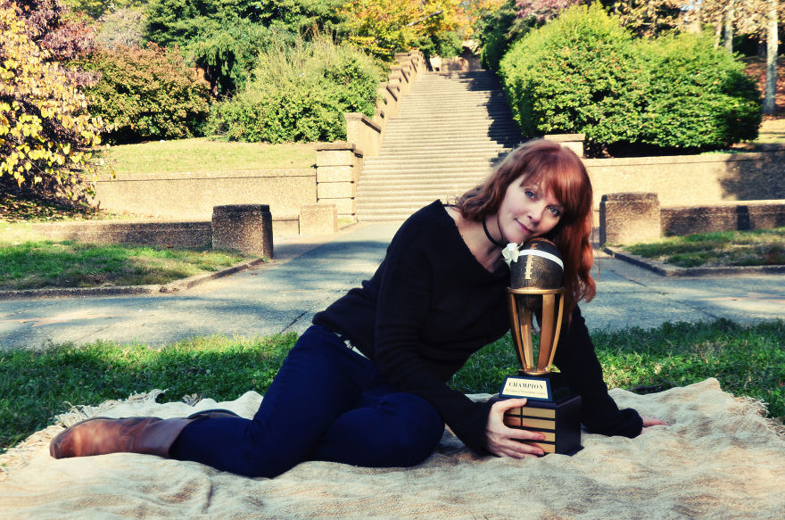 Woman Poses For Mommy-Baby Portraits With Fantasy Football Trophy Woman Poses For Mommy-Baby Portraits With Fantasy Football Trophy