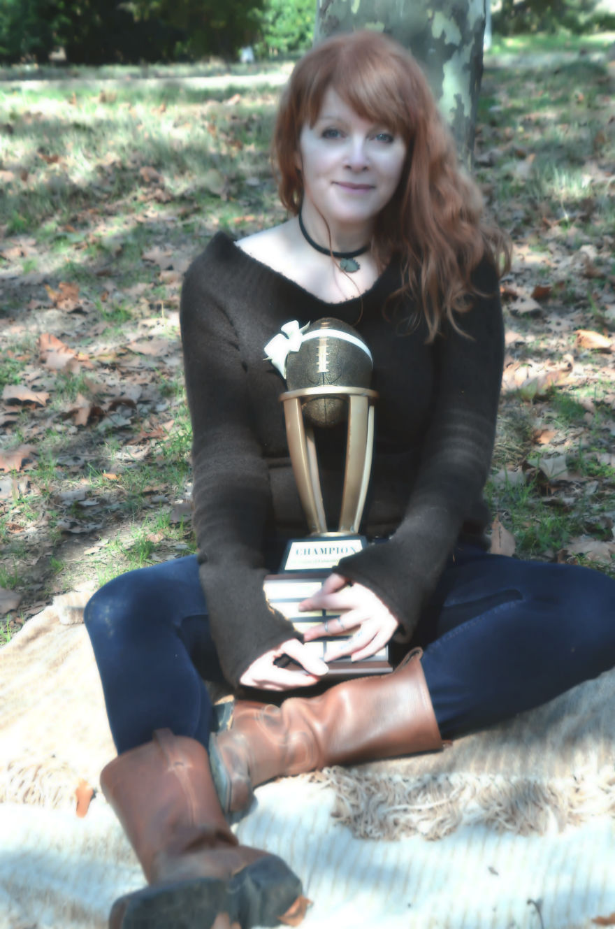 Woman Poses For Mommy-Baby Portraits With Fantasy Football Trophy Woman Poses For Mommy-Baby Portraits With Fantasy Football Trophy
