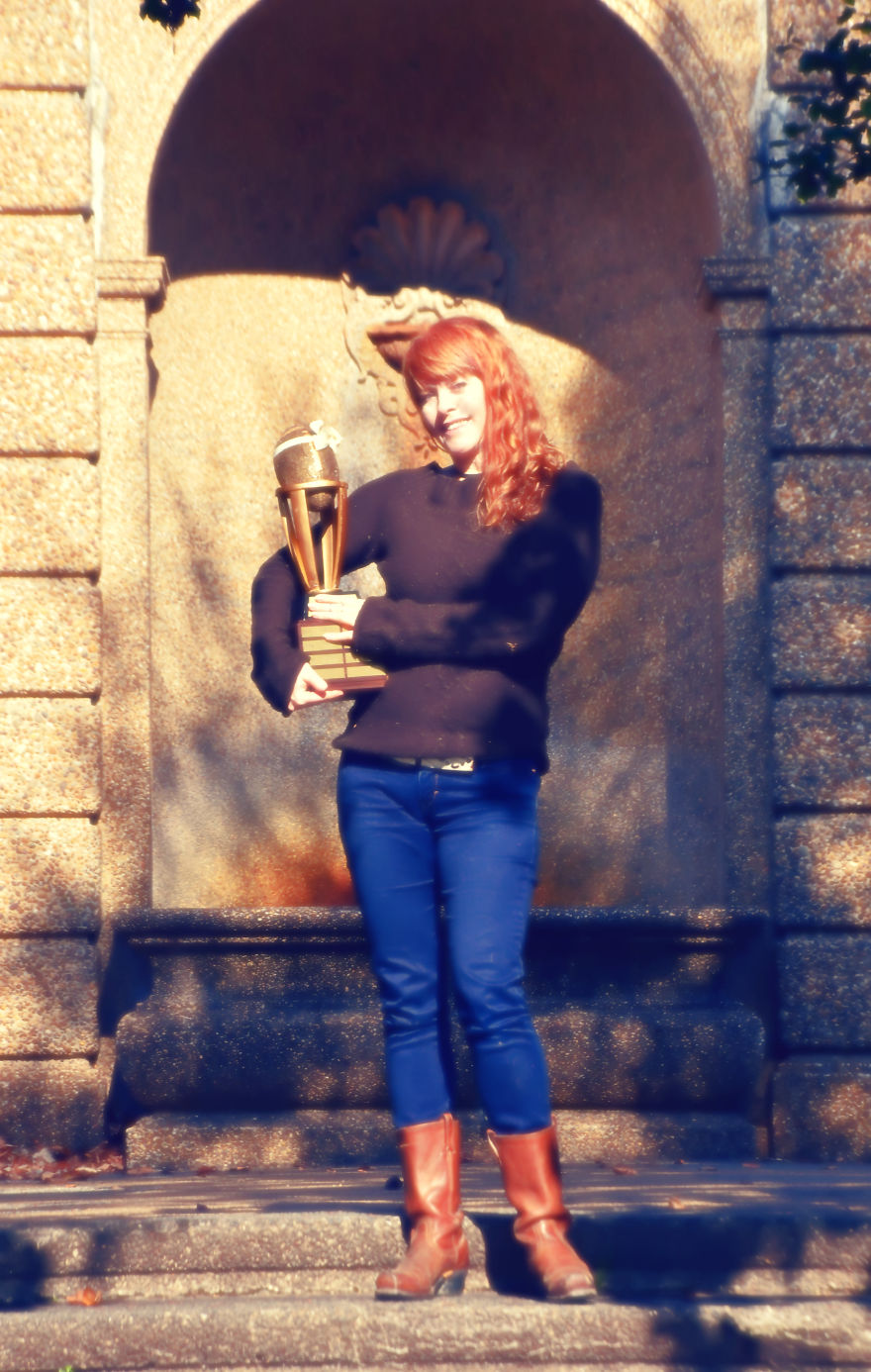 Woman Poses For Mommy-Baby Portraits With Fantasy Football Trophy Woman Poses For Mommy-Baby Portraits With Fantasy Football Trophy