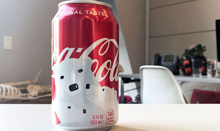 Coca-Cola's Holiday Cans Contain Hidden Designs, And You'll Smile When You Notice Them