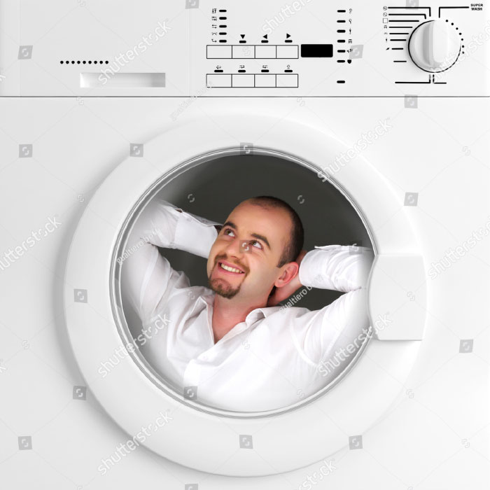 Man in a white shirt is having a relaxing time inside the washing machine
