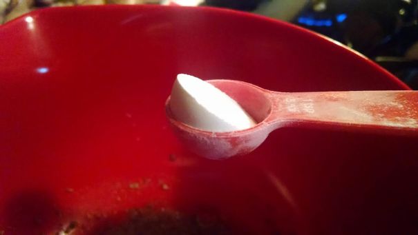 Measured A Teaspoon Of Baking Powder, Then Accidentally Tapped The Spoon On The Bowl. The Powder Didn't Spill, But Shifted, While Retaining The Perfect Shape Of The Spoon