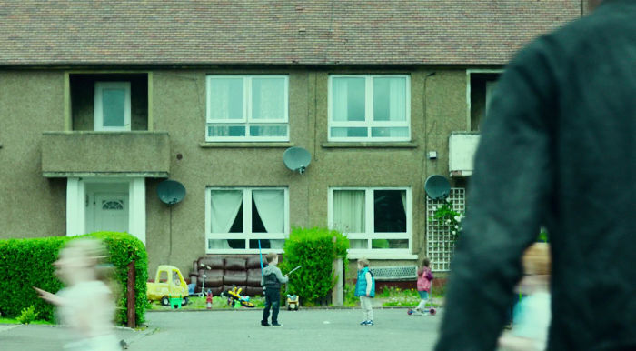 T2: Trainspotting - There's A Boy Playing With A Blue (Obi-Wan) Lightsaber Outside Renton's (Ewan Macgregor's) Old Home