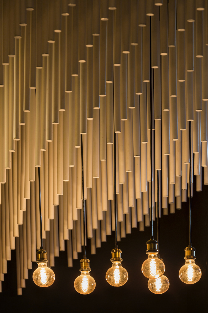 Using 1500 Circular Rods Hanging In An Organic Wave Structure Installation