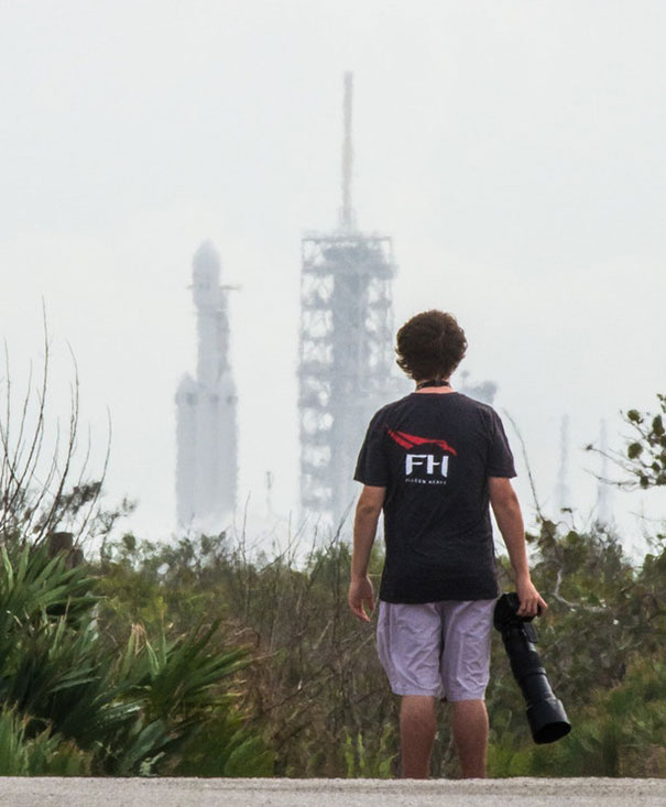 I Photographed My Friend Wearing A Falcon Heavy T-Shirt As He Looked At The Falcon Heavy Rocket Standing Vertical For The Very First Time